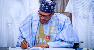 Buhari signs climate change, AMCON amendment bills into law 